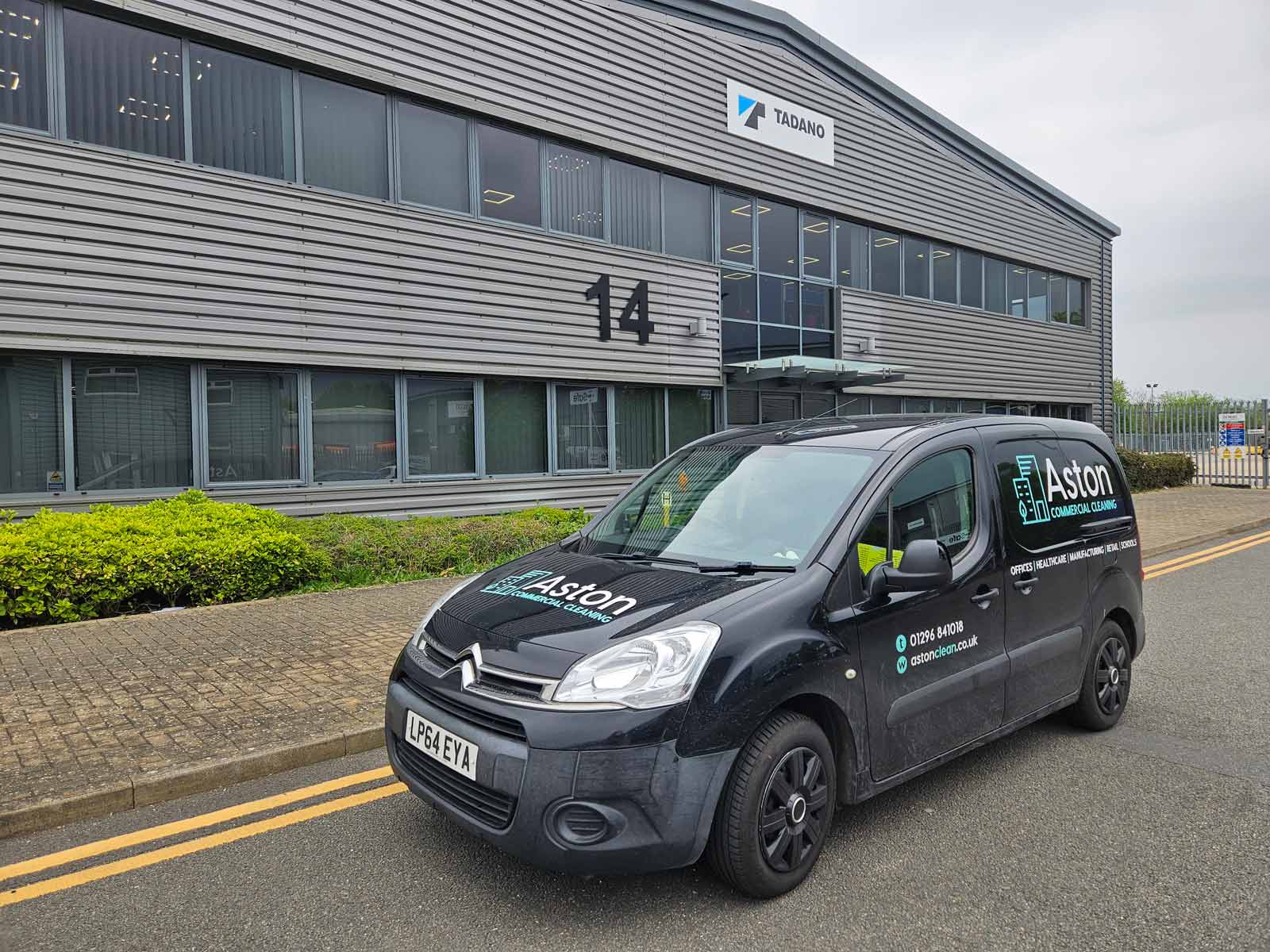 Professional window cleaner cleaning commercial office windows